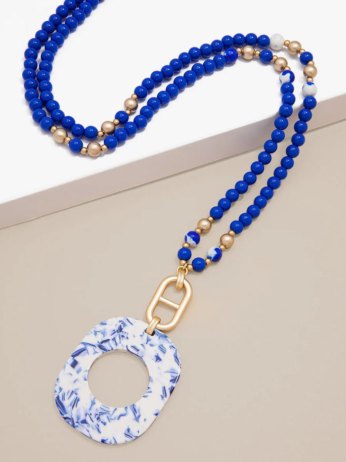 Emblem Charm and Blue Marbled Acetate Pendant Necklace